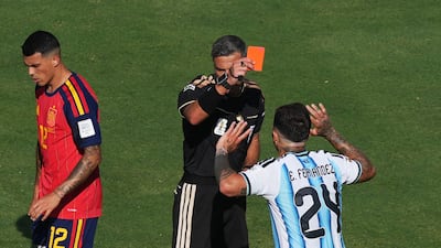 Argentina's Enzo Fernandez is shown a red card by referee Slavko Vincic. Reuters