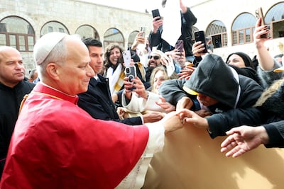Pope Leo XIV greets well-wishers at the tomb of St Charbel. AFP