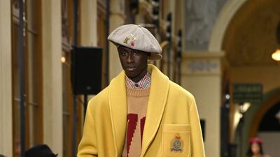 A relaxed silhouette at Kenzo, with a drop shouldered coat in yellow, with large patch pockets.