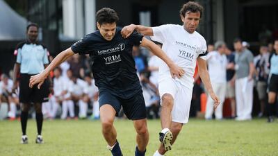 Jari Litmanen of Team Laureus and former Al Jazira coach Luis Milla of Team YR1M in action during the Laureus All Stars Unity Cup on Tuesday. Ian Walton / Getty Images / March 25, 2014