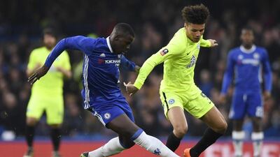 Chelsea defender Kurt Zouma tackles Peterborough’s Lee Angol. Tony O’Brien / Reuters