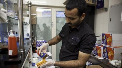 Its precise origins are a mystery, but most believe the sandwich is a schoolboy creation from the 1980s or 1990s derived from the much-loved Chips Oman milkshake, laban stirred with crushed chips and a few drops of hot sauce. Jaime Puebla / The National