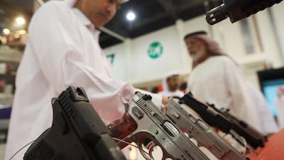 A visitor checks the displayed handguns at the MP3 stall. Ravindranath K / The National?