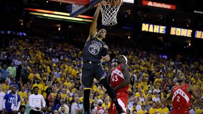 Golden State Warriors guard Shaun Livingston dunks over Toronto Raptors forward Pascal Siakam. AP Photo