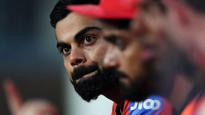 Royal Challengers Bangalore captain Virat Kohli watches on from the dugout during his side's record low batting total of 49 against Kolkata Knight Riders. Dibyangshu Sarkar / AFP