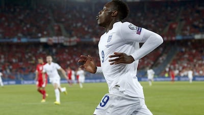 Danny Welbeck celebrates after scoring England's first goal in their win over Switzerland in Euro 2016 qualifying on Monday. peter Klaunzer / EPA / September 8, 2014