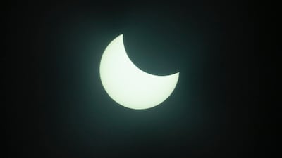 About 814 million people around the world are expected to see the partial solar eclipse. Antonie Robertson / The National