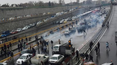 People protest against increased gas price, on a highway in Tehran, Iran. Nazanin Tabatabaee/WANA (West Asia News Agency) via REUTERS