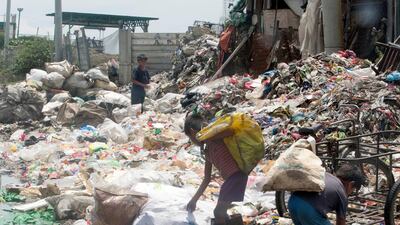 Children scavengers pick through the trash at "Smokey Mountain Reclamation Area " located in North Manila. Mike Young for the National