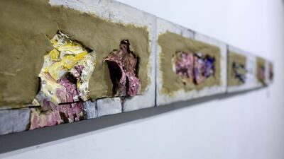 Digging for Buried Sounds Series, a mixed-media artwork by Philippine artist JC Jacinto, is on display during the opening for the Philippine Art Month.