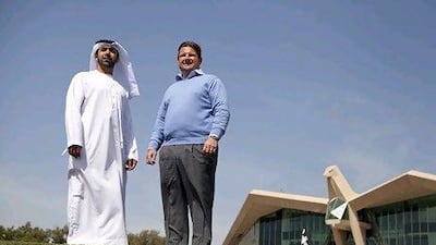 Mubarak Rashed Al Nuaimi, of the Abu Dhabi Tourism Authority, left, with Ken Kosak at Abu Dhabi Golf Club. Silvia Razgova / The National