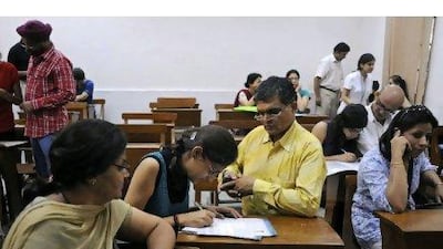 Delhi University applicants who want to pursue a qualification in commerce cannot afford any slip-ups at school if they wish to be admitted to the course. Tsering Topgyal / AP Photo
