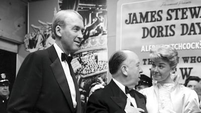 Director Alfred Hitchcock with actor Jimmy Stewart and actress Doris Day at the premier of 'The Man Who Knew Too Much' in Los Angeles, California. Earl Leaf / Michael Ochs Archives / Getty Images