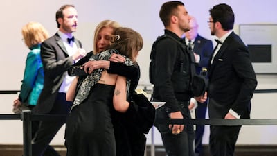People embrace following a shooting incident during the annual White House Correspondents’ Association dinner in Washington, D. C. , U. S. , April 25, 2026 REUTERS / Jonathan Ernst