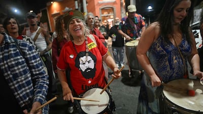 Rio de Janeiro residents celebrate the Supreme Court's decision to sentence Bolsonaro to more than 27 years in jail. AFP