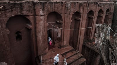 Ethiopian Orthodox devotees are pictured walking between the rock-hewn churches of St Gabriel and St Raphael in Lalibela, on March 7, 2019. AFP
