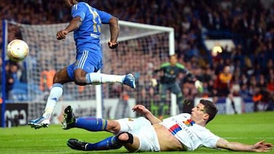 Chelsea's Viktor Moses rides the challenge of Basle's Fabian Schaer during the London club's 3-1 win to send them through to the Europa League final in Amsterdam.