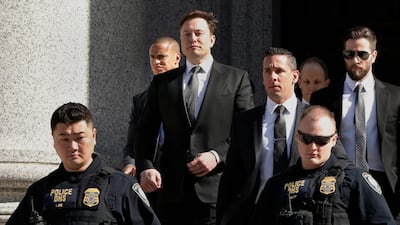 Tesla CEO Elon Musk leaves Manhattan Federal Court, in New York. In a letter filed on April 18, 2019, lawyers for Musk and the US government asked for another week to negotiate a deal to keep Musk from being found in contempt of court. (AP Photo/Richard Drew, File)