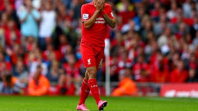 Philippe Coutinho of Liverpool walks off the pitch after receiving a red card in his side's loss to West Ham United at Anfield on Saturday. Clive Mason / Getty Images