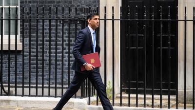 LONDON, ENGLAND - MAY 26: Chancellor Rishi Sunak leaves number 11, Downing Street on May 26, 2022 in London, England. An announcement is expected to be made by Chancellor Rishi Sunak later, knocking hundreds of pounds off domestic energy bills this winter, largely funded by a windfall tax on oil and gas firms that could raise £7bn. (Photo by Leon Neal / Getty Images)