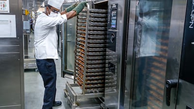 Once roasted, the chickens are ready to be packed with biryani rice.