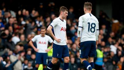 Tottenham Hotspur's Argentinian midfielder Giovani Lo Celso (R) and teammates react at the final whistle. AFP