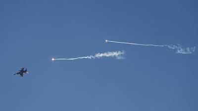 An Israeli fighter jet fires flares as it intercepts a projectile launched by Hezbollah in Lebanon. AFP