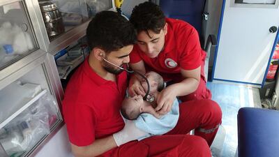 Paramedics from the Syrian Arab Red Crescent from Dmair sub-branch evacuate conjoined twin baby boys Nawras and Moaz from eastern Ghouta to the Children's Hospital in Damascus on August 12, 2016. Photo: Syrian Arab Red Crescent