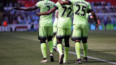 Manchester City’s Kelechi Iheanacho (cL) celebrates scoring the 1-0 with teammates during the Premier League match between Swansea City and Manchester City at the Liberty Stadium in Swansea, Wales, Britain, 15 May 2016. Dimitris Legakis / EPA