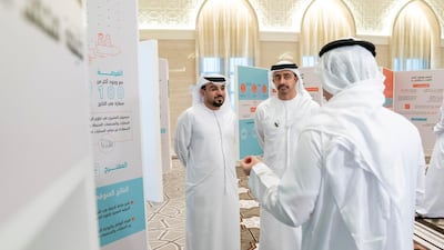 Sheikh Abdullah bin Zayed, Minister of Foreign Affairs and International Co-operation, listens to a Capstone project presentation.