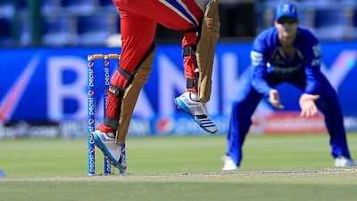 Albie Morkel of Royal Challengers Bangalore takes a swing during the Indian Premier League match against Rajasthan Royals at Zayed Cricket Stadium on April 26, 2014, in Abu Dhabi. Ravindranath K / The National