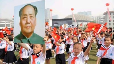 Thousands of Chinese students holding Communist flags and a portrait of China's late leader Mao Zedong: For all the mistakes Mao is acknowledged to have made, he remains a legendary figure in China. AFP CHINA