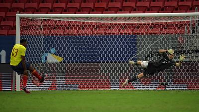 Argentina goalkeeper Emiliano Martinez saves the penalty from Colombia's Yerry Mina.
