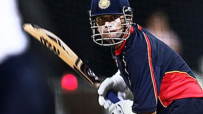 Rahul Dravid, a member of the MCC team, keeps his focus to adjust to the pink ball during practice at the Zayed Stadium.
