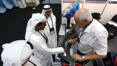 Above, visitors at the Cast Iron Welding Services stand during the POWER-GEN Middle East Conference and Exhibition in Abu Dhabi. Satish Kumar / The National