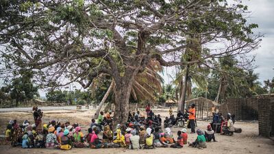 Residents gather for a meeting in the recently attacked village of Aldeia da Paz outside Macomia, on August 24, 2019. ISIS-linked fighters have attacked the region again in recent days. AFP