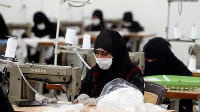 Women make protective face mask at a textile factory in Sanaa, Yemen. EPA
