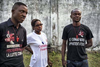 From left, Adonis Kabeya, 31; Audrey Kendra, 21; and Alain Mulumba Kabeya, 28, of the Kinshasa cell of Filimbi. Holly Pickett for The National