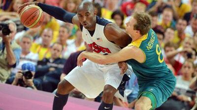 USA guard Kobe Bryant is challenged by Australian forward Brad Newley