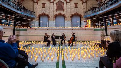 The Bloomsbury String Quartet perform on Thursday evening in an empty swimming pool during the Vivaldi and Mozart Candlelit Concert at Victoria Baths in Manchester. Getty Images