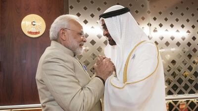 ABU DHABI, UNITED ARAB EMIRATES - February 10, 2018: HH Sheikh Mohamed bin Zayed Al Nahyan Crown Prince of Abu Dhabi Deputy Supreme Commander of the UAE Armed Forces (R), receives HE Narendra Modi Prime Minister of India (L), at the Presidential Airport. ( Rashed Al Mansoori / Crown Prince Court - Abu Dhabi ) ---