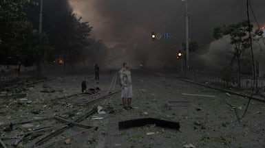 A man shrouded in smoke assesses heavy damage to buildings after Russian bombardment in Kyiv, Ukraine, in which several people were badly wounded. AFP