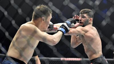 Amir Albazi (R) of Iraq punches Zhalgas Zhumagulov of Kazakhstan during the UFC 257 event inside Etihad Arena on UFC Fight Island. Chris Unger/Zuffa LLC