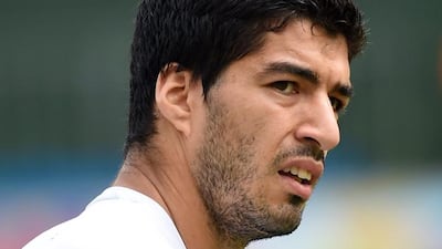 Luis Suarez has been banned for four months. AFP