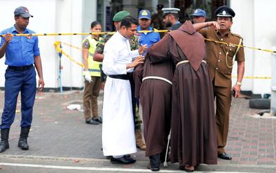 Priests walk into the St Anthony's Shrine. Reuters
