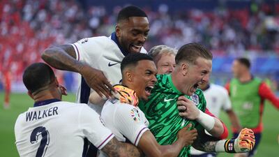 Trent Alexander-Arnold celebrates with teammates Kyle Walker, Ivan Toney and Jordan Pickford after winning the shoot-out. The match had finished 1-1 after extra-time. Getty Images