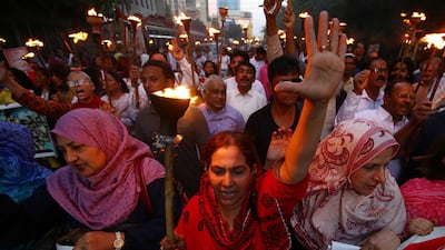 Activists of the Pakistan Food Workers Federation hold torches and banners and chant slogans as they join a rally on the eve of World Labor Day in Karachi, Pakistan, 30 April 2023. Labor Day is an annual holiday that takes place on 01 May and celebrates laborers, their rights, achievements, and contributions to society. EPA / SHAHZAIB AKBER