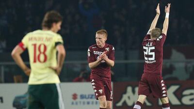 Torino's Kamil Glik celebrates after scoring the equaliser in a 1-1 Serie A draw with AC Milan on Saturday. Marco Bertorello / AFP / January 10, 2015