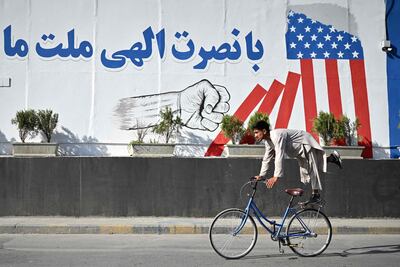 A poster celebrates Afghanistan's 'defeat' of America, as the Taliban mark the fifth anniversary of their return to power. AFP