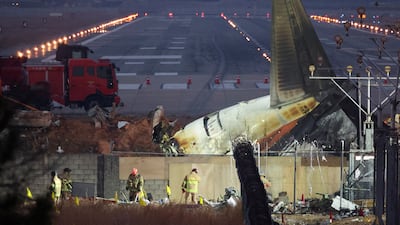 Rescuers work near the wreckage of the Jeju Air aircraft that crashed at Muan International Airport, South Korea. Reuters